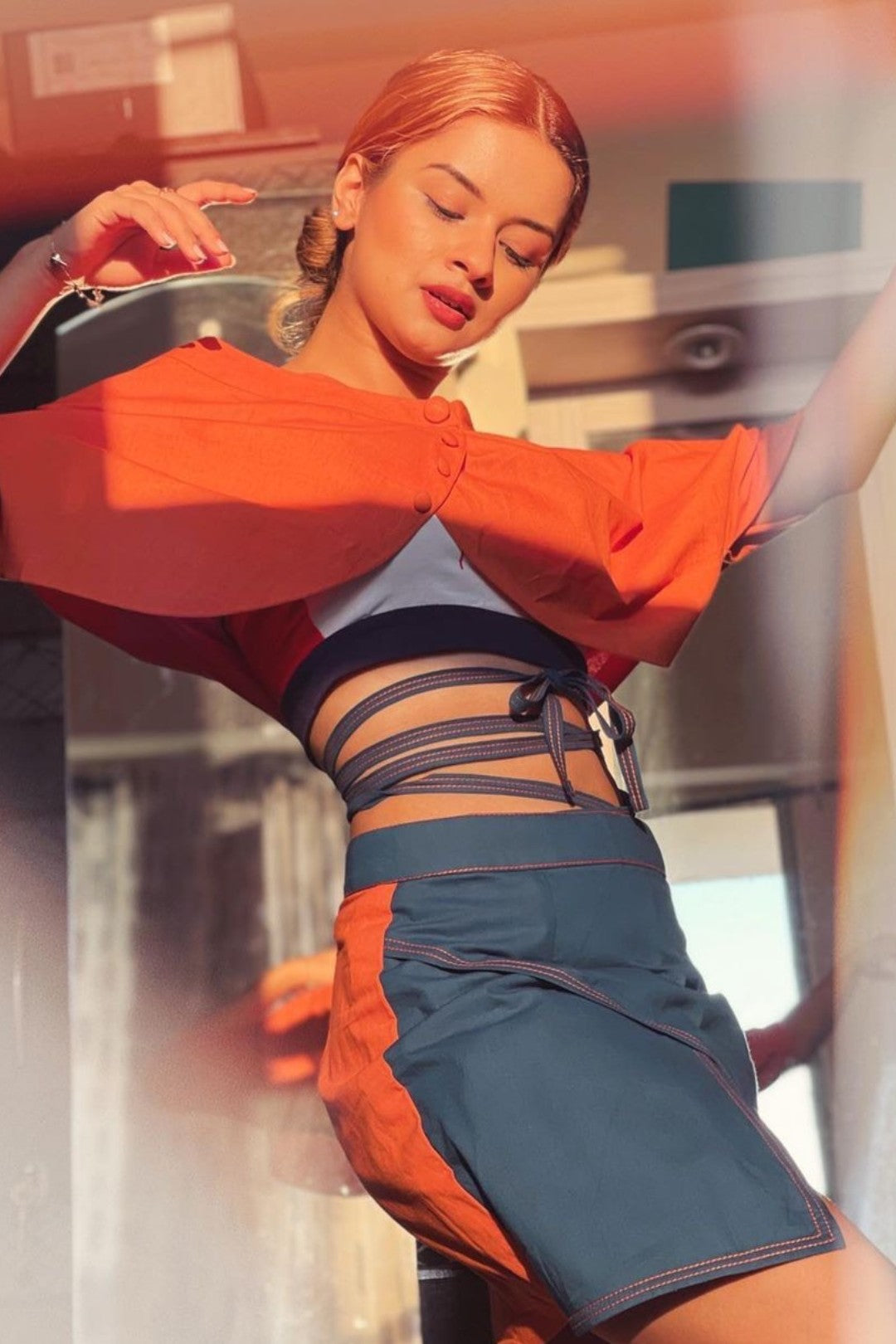 Burnt orange shrug blouse with short flap skirt