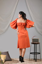 Burnt orange puff front shift dress with side slit